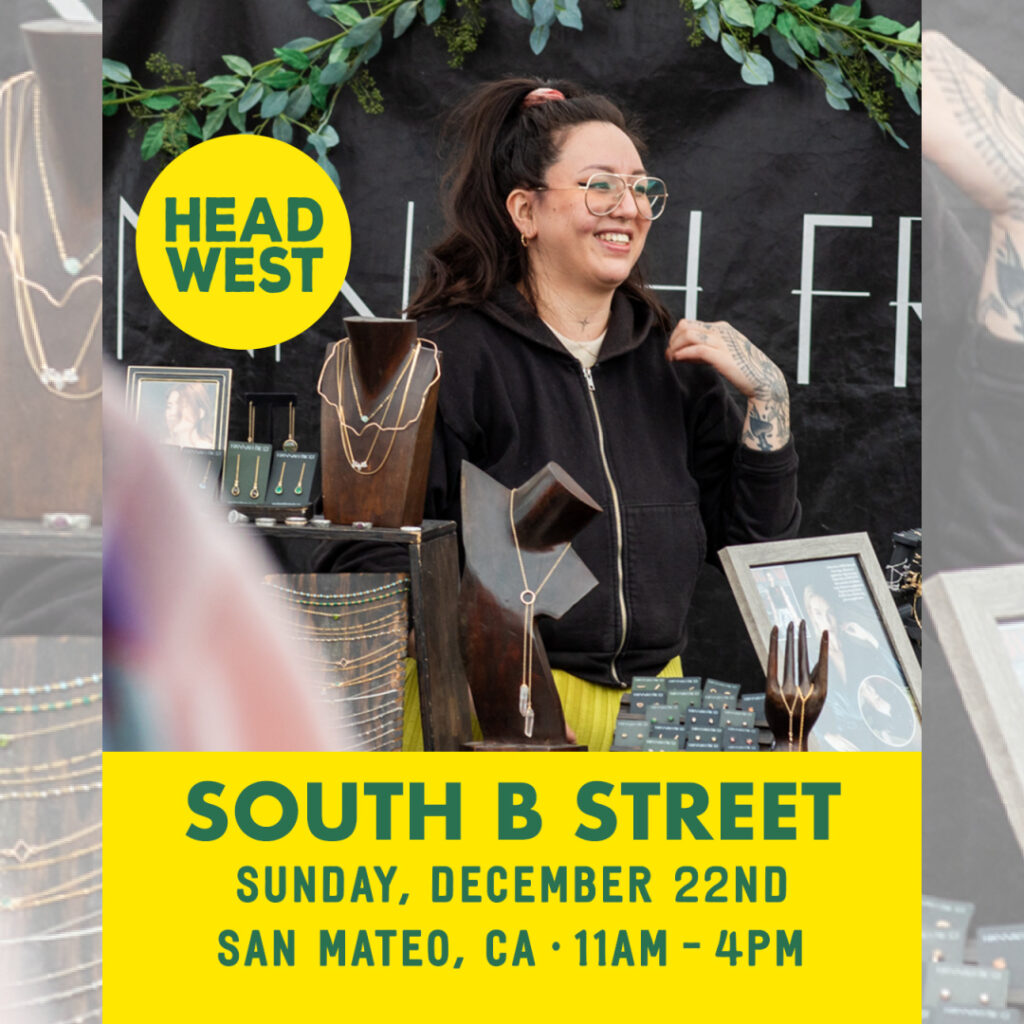 Image of a jewelry designer smiling at HEAD WEST Marketplace