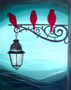 painting of red birds on a lamp post
