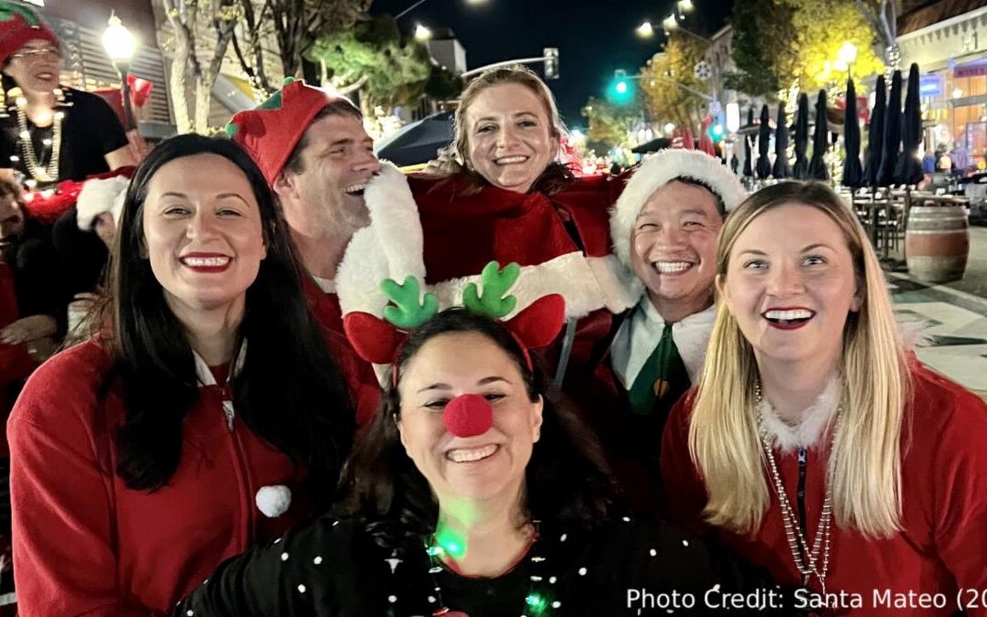 Photo of 6 people dressed in Christmas outfits