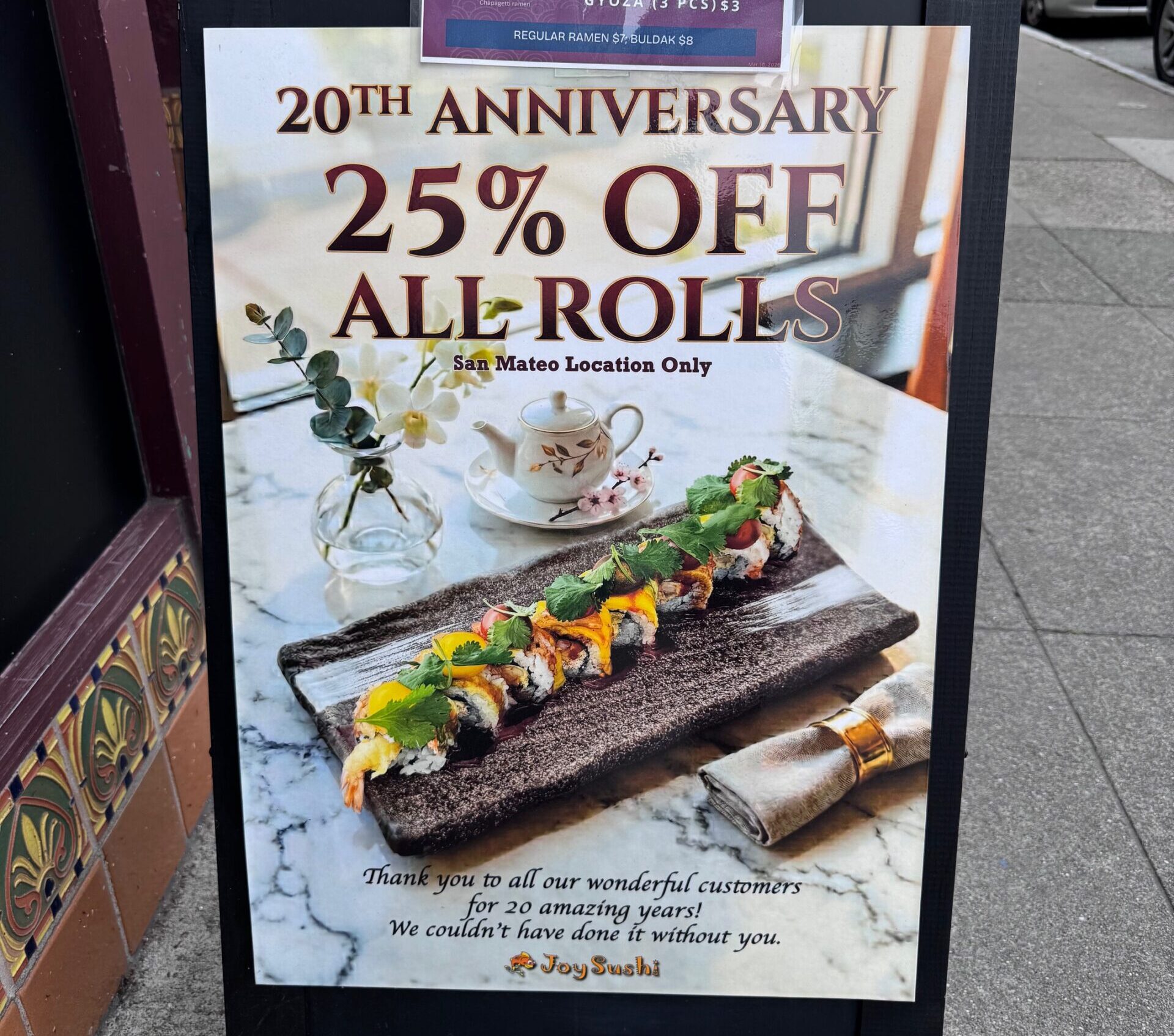 photo of an A frame sign advertising the 20th anniversary promotion