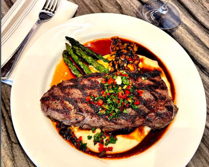 photo of a steak, asparagus, and mashed potatoes on a plate